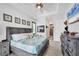 Bright bedroom with tray ceiling, coastal decorations and access to an ensuite bathroom at 530 Spaniards Rd, Placida, FL 33946