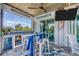 Outdoor patio featuring a bar, stools, television, ceiling fans, and beautiful design at 530 Spaniards Rd, Placida, FL 33946