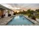 Relax by the pool in this backyard oasis including a grilling area, sun loungers, and tropical landscaping at 530 Spaniards Rd, Placida, FL 33946
