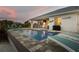 Enjoy Florida evenings by the pool in this backyard oasis including a covered bar and several seating areas at 530 Spaniards Rd, Placida, FL 33946