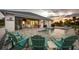 Inviting pool area featuring patio seating and lush landscaping for outdoor enjoyment at sunset at 530 Spaniards Rd, Placida, FL 33946