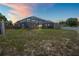 Spacious backyard featuring a screened-in pool, perfect for outdoor enjoyment and relaxation at 5510 Moongate Rd, Spring Hill, FL 34606