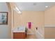 Well-lit bathroom featuring a bathtub, vanity with a mirror, tile flooring, and neutral colored walls at 5510 Moongate Rd, Spring Hill, FL 34606
