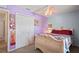 Cozy bedroom featuring a unique ceiling fan and a comfortable-looking bed at 5510 Moongate Rd, Spring Hill, FL 34606