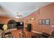 Inviting living room featuring a large window and entertainment center at 5510 Moongate Rd, Spring Hill, FL 34606