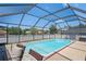 Enjoy a refreshing swim in this screened-in pool with ample space for lounging at 5510 Moongate Rd, Spring Hill, FL 34606
