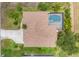 Aerial view of the property, showing roof, pool, and surrounding landscaping at 59 White Marsh Ln, Rotonda West, FL 33947