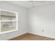Clean bedroom with a window, laminate wood flooring, and neutral walls at 59 White Marsh Ln, Rotonda West, FL 33947