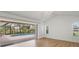 Bright bedroom with sliding glass doors to screened lanai and a view of the pool at 59 White Marsh Ln, Rotonda West, FL 33947
