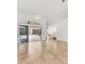 Spacious living room with tile flooring, sliding glass doors to the lanai, and abundant natural light at 59 White Marsh Ln, Rotonda West, FL 33947