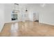 Open living room with tile floors, a large window, and elegant lighting, perfect for entertaining at 59 White Marsh Ln, Rotonda West, FL 33947