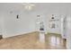 Spacious living room with tile flooring, a large window, and modern lighting creating an inviting atmosphere at 59 White Marsh Ln, Rotonda West, FL 33947