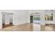 Bright main bedroom with tile flooring, sliding glass doors to pool, and a walk-in closet entrance at 59 White Marsh Ln, Rotonda West, FL 33947