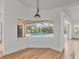 Bright dining area with a large window providing a clear view of the screened-in pool at 59 White Marsh Ln, Rotonda West, FL 33947