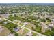 An aerial view of the property highlighting its location within a serene, tree-lined residential community at 6158 Cavan St, Englewood, FL 34224