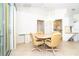 Bright dining area with tile floors, a modern table and chairs, a chandelier, and plenty of natural light at 6158 Cavan St, Englewood, FL 34224