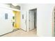 Entryway view with a double front door showing tile floors, an open floorplan, and great natural light at 6158 Cavan St, Englewood, FL 34224