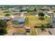 Spacious property with a well-manicured lawn, featuring a screened lanai and outdoor shed at 7048 Inland St, Englewood, FL 34224