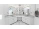 Bright bathroom with dual sinks, large mirrors, and ample lighting, creating a spa-like atmosphere at 7048 Inland St, Englewood, FL 34224