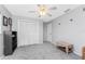 Cozy bedroom with neutral walls, carpeted floors, spacious closet, and decorative wicker bench at 7048 Inland St, Englewood, FL 34224