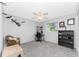 Comfortable bedroom featuring a ceiling fan, grey walls, carpeted floors, and a study area with a window at 7048 Inland St, Englewood, FL 34224