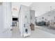 Bright foyer with decoratively displayed ladder shelf, vaulted ceilings and entry to dining and living areas at 7048 Inland St, Englewood, FL 34224