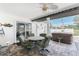Relaxing lanai with outdoor dining, hot tub and views of the surrounding landscape at 7048 Inland St, Englewood, FL 34224