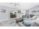 Cozy living space featuring an open floor plan that connects to the kitchen and outdoor dining area at 7048 Inland St, Englewood, FL 34224