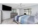 Stylish bedroom with a king bed, contemporary furniture, and a view to the outside patio at 7048 Inland St, Englewood, FL 34224