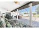 Relaxing screened patio with stylish lounge chairs and a luxurious hot tub for ultimate comfort and enjoyment at 7048 Inland St, Englewood, FL 34224