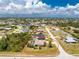 Aerial view of a beautiful single-Gathering home with a screened pool and well-maintained landscaping at 7247 Brookhaven Ter, Englewood, FL 34224