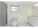 Bathroom with a walk-in shower, marble countertop and ample lighting at 7247 Brookhaven Ter, Englewood, FL 34224
