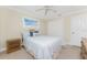 Cozy bedroom featuring a comfortable bed, neutral walls, and bright natural light through the window at 7247 Brookhaven Ter, Englewood, FL 34224