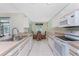 Well-lit kitchen showcasing the dining space and appliances at 7247 Brookhaven Ter, Englewood, FL 34224