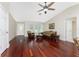 Elegant living room featuring hardwood floors, neutral paint, and a vaulted ceiling at 7247 Brookhaven Ter, Englewood, FL 34224