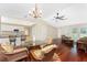View of the combined living, dining and kitchen areas with hardwood floors at 7247 Brookhaven Ter, Englewood, FL 34224