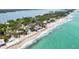Aerial view of beachfront homes lining turquoise waters and a sandy shore at 7420 Manasota Key Rd, Englewood, FL 34223