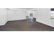 Expansive unfinished basement with a concrete floor, white walls and ceilings, and sliding glass doors to the outside at 7420 Manasota Key Rd, Englewood, FL 34223