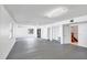Spacious basement featuring concrete floors, white walls and ceilings, and natural light at 7420 Manasota Key Rd, Englewood, FL 34223