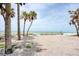 Stunning beachfront property with palm trees and turquoise water views at 7420 Manasota Key Rd, Englewood, FL 34223