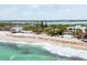 Stunning beachfront homes with palms, soft sand, and inviting turquoise waters, perfect for coastal living at 7420 Manasota Key Rd, Englewood, FL 34223