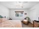 Bright bedroom with a beach view through a window and tropical decor at 7420 Manasota Key Rd, Englewood, FL 34223