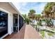 Outdoor deck with screened-in enclosure provides a comfortable space for enjoying beach views at 7420 Manasota Key Rd, Englewood, FL 34223