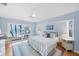 Light and airy main bedroom with sliding glass door to outdoor living and ocean views at 7420 Manasota Key Rd, Englewood, FL 34223