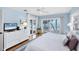 Light and airy main bedroom with sliding glass door to outdoor living and ocean views at 7420 Manasota Key Rd, Englewood, FL 34223