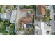 A birds-eye view shows this coastal home with a screened-in pool, and well manicured landscaped yard at 7530 Whitcomb St, Englewood, FL 34223