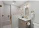Stylish bathroom with glass-enclosed shower, modern vanity, and elegant gold accents at 7530 Whitcomb St, Englewood, FL 34223
