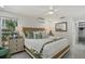 Comfortable bedroom featuring a ceiling fan and bright, natural light at 7530 Whitcomb St, Englewood, FL 34223