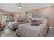 Bright bedroom with pink decor, two beds, and a view of the outdoor patio at 7530 Whitcomb St, Englewood, FL 34223