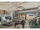 Garage converted into a living space, featuring cozy seating and stylish decor at 7530 Whitcomb St, Englewood, FL 34223